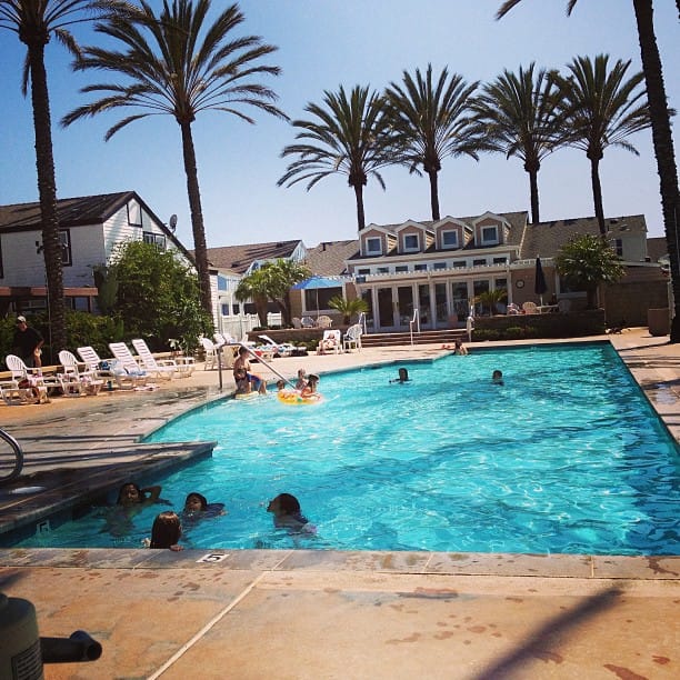 Watching the kids swim at the pool.