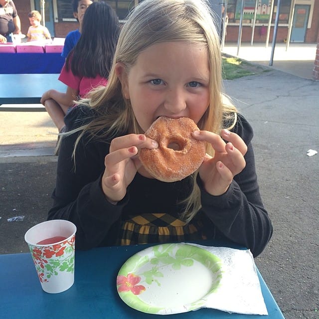 Jess eating with me at Donuts with Dad at her school