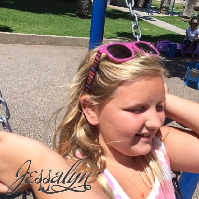 My daughter Jessalyn swinging at the park.