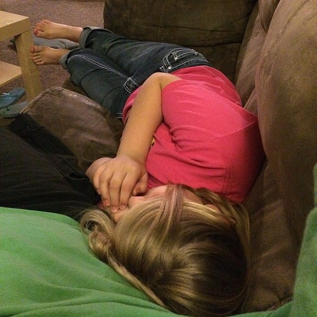 "Looking down" my daughter has her head on me resting as we finished watching a movie #365 Post image