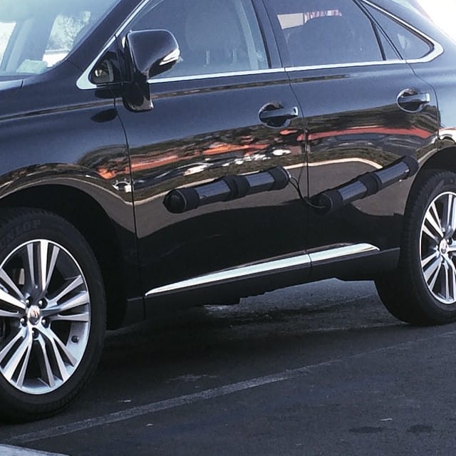 Dearest Internet, what the heck are these things attached to the side of this Lexus? He attacked them when he parked. Post image