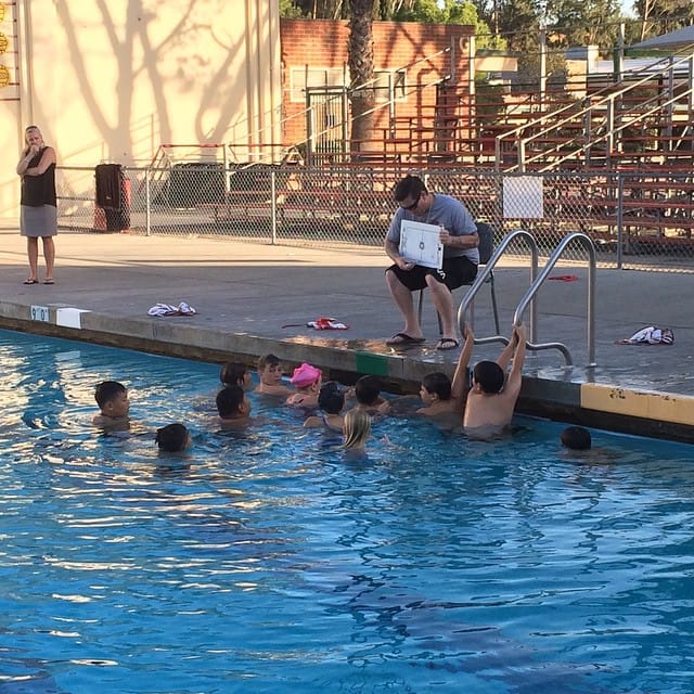 Coach is teaching the kids plays Post image