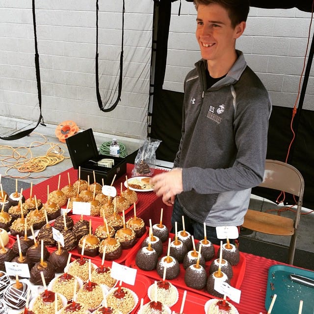 My son @insert_awesomeness_here selling apples at Family Fun Night Post image