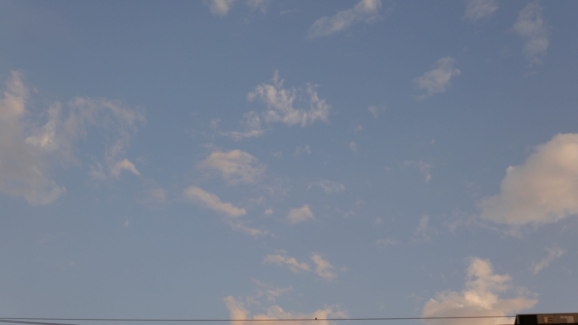 Head in the clouds - 4K time-lapse of clouds with birds on a power line Post image