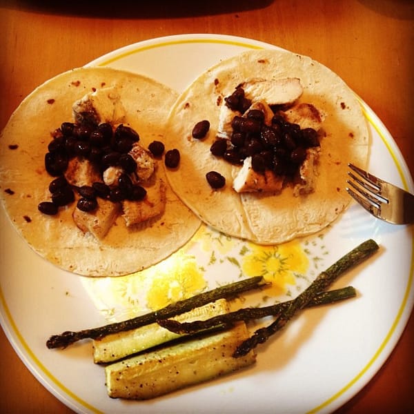 Chicken, black beans, and tortilla along with asparagus and cucumbers for dinner.