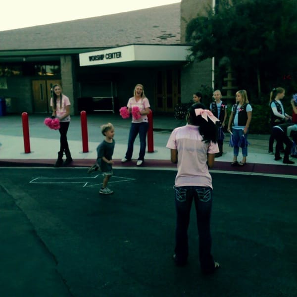 My Girl Scout and her troop cheering for the runners for Run the Race at WACC