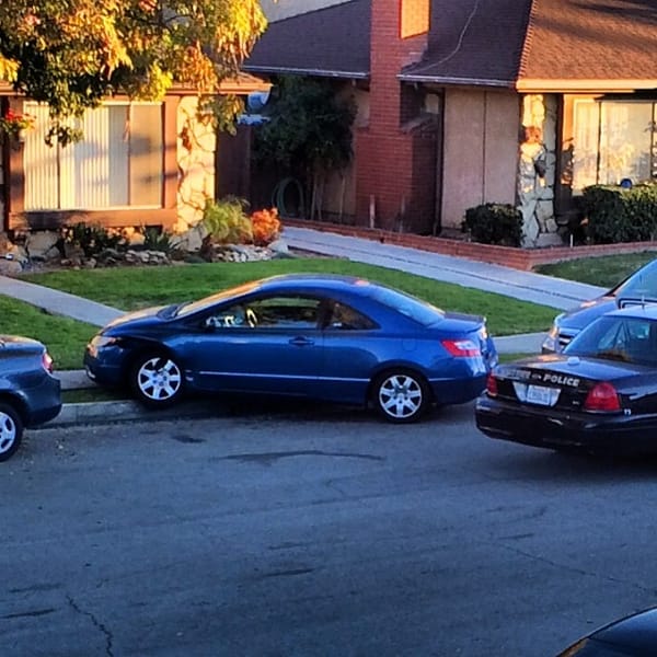 I'm not quite sure what happened here. Neighbor's car on the curb #suckymorning