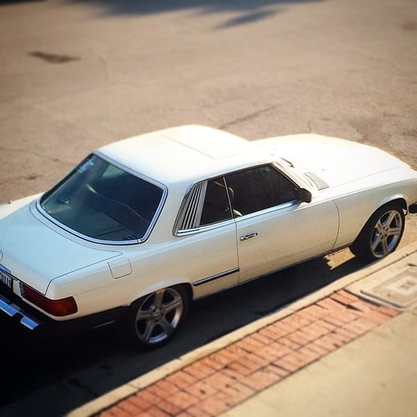 Wrenching on my sons car tonight, a mechanic neighbor of ours has been helping us out. #80 #mercedes #450slc