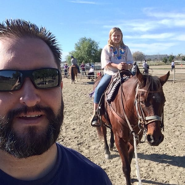 Leading Jess and Joe around the arena.