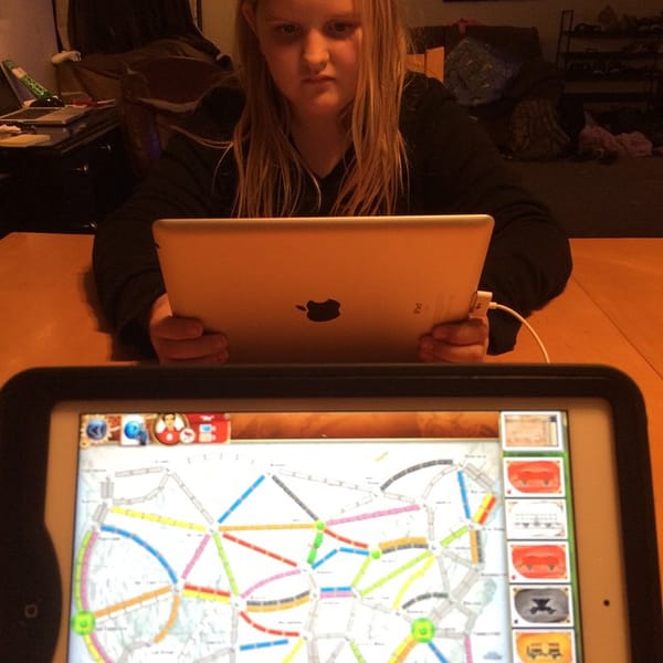 Ticket to ride on two iPads.