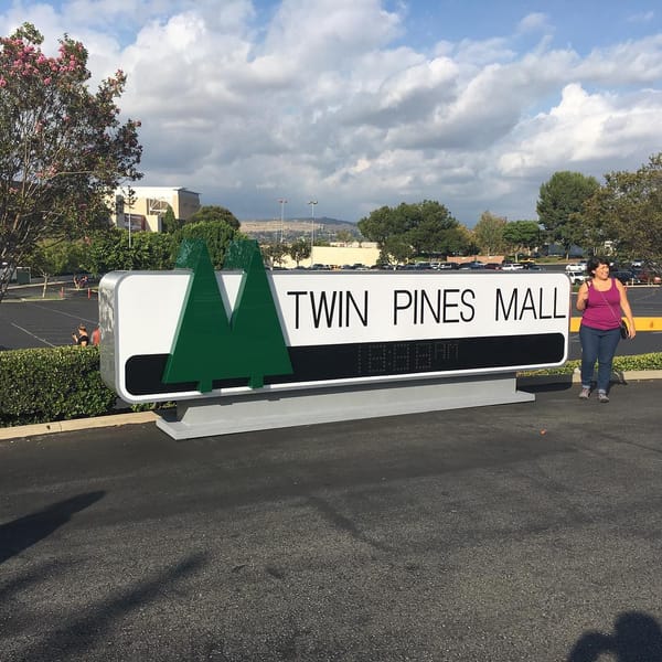 Twin Pines Mall sign