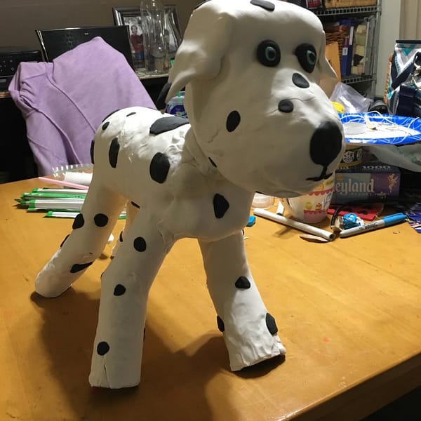 Jess and I made this Dalmatian for her book report for school. It's made from a 2 liter bottle, cardboard toilet paper rolls for the legs and lots of 
