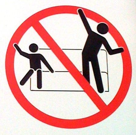 “No Dancing” sign on Disneyland rides Feature image