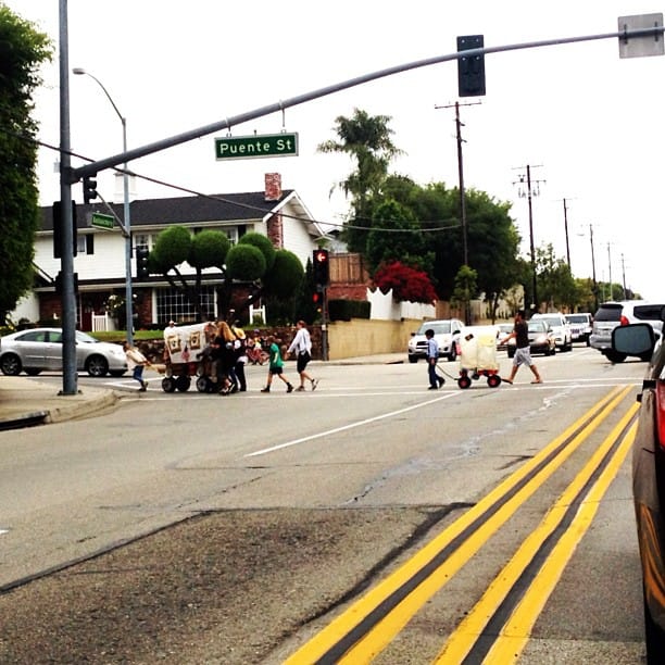 Oregon Trail on my way to work #kids #school #project #redwagon #coveredwagon Feature image
