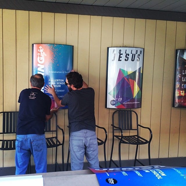 Hard at work putting up signage #evfreefullerton Feature image