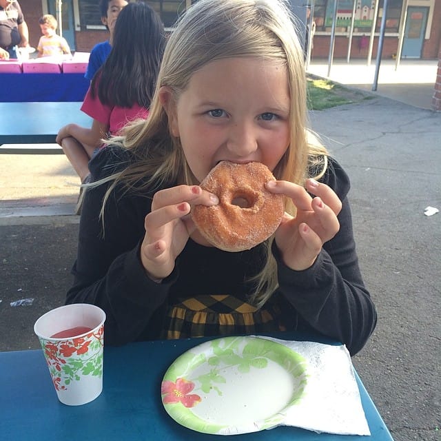 Jess eating with me at Donuts with Dad at her school Feature image