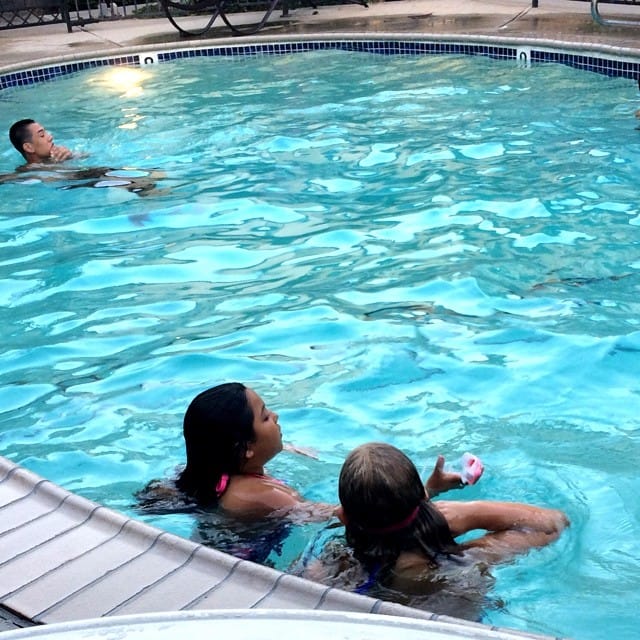 Watching my lil girl and our neighbor swim. Feature image