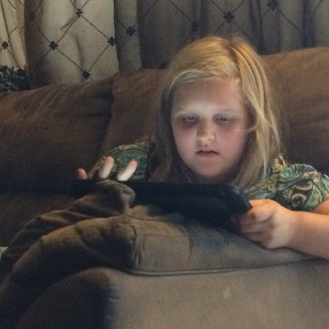 My little one playing adventure time on the iPad. Feature image