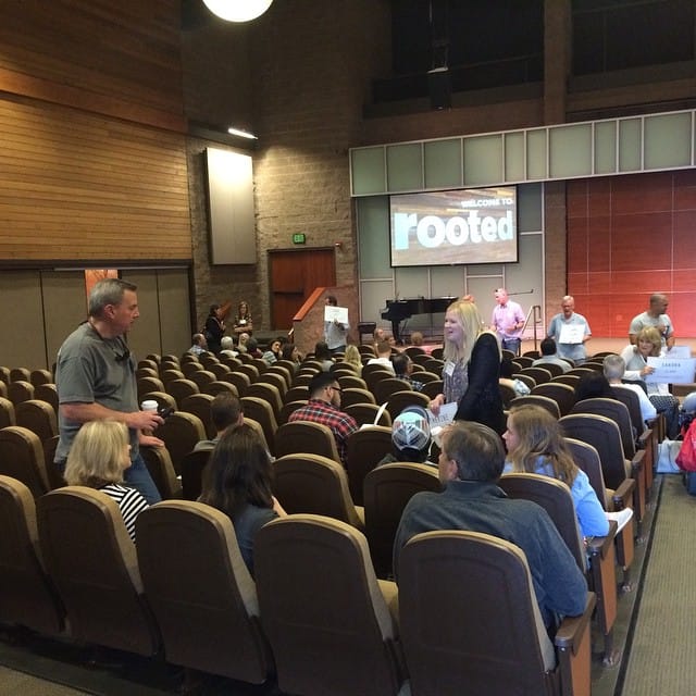 First few people people walking into Rooted Kickoff Feature image