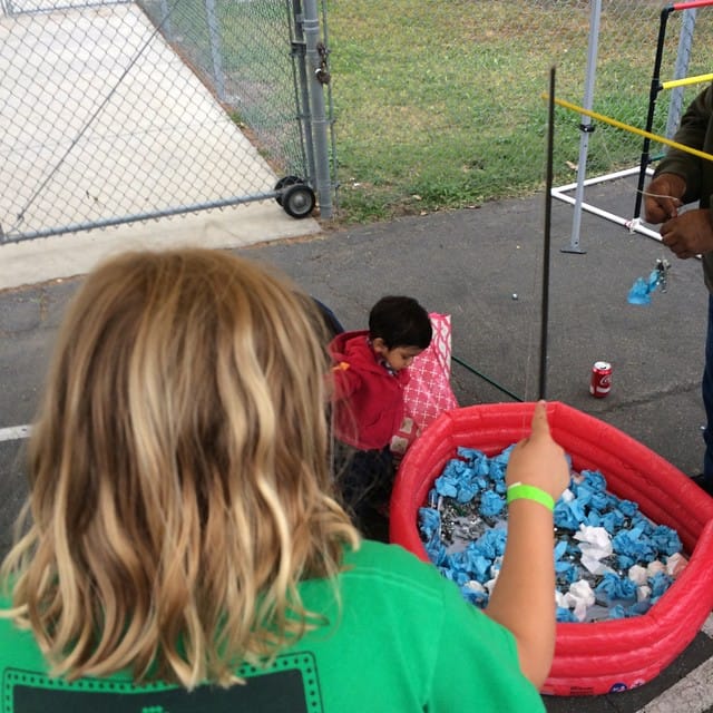 Jess fishing for nuts and bolts at Family Fun Night Feature image
