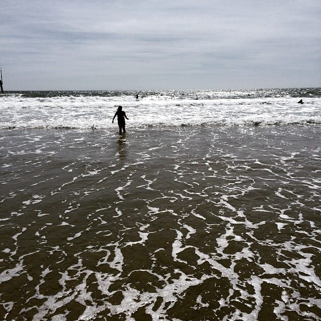 Celebratory dip in the Pacific Ocean after a bike ride from The Wedge to HB pier Feature image