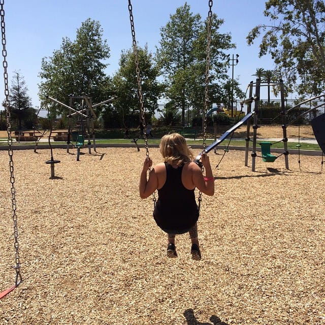 She's not too big to be pushed on the swing Feature image