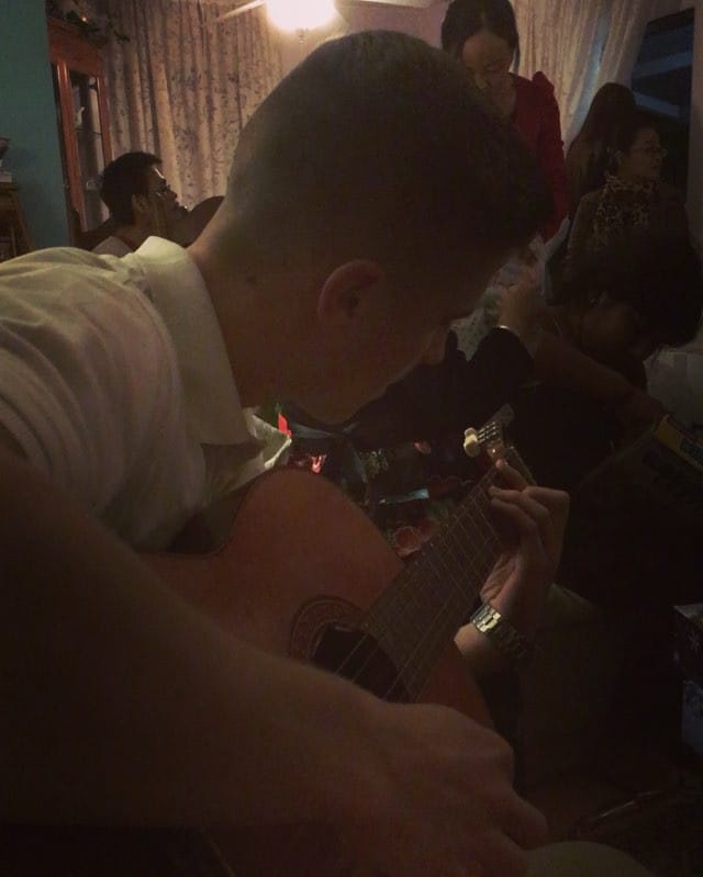 Chris getting down on the guitar Feature image